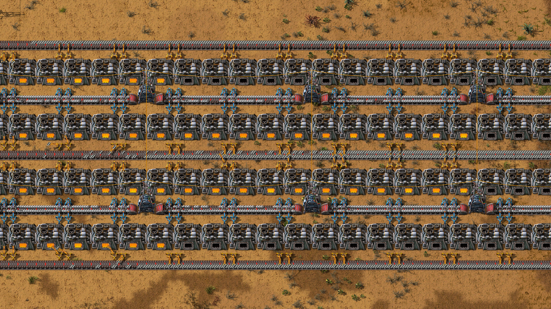 Ряды сборочных автоматов Factorio с манипуляторами между машинами и конвейерами