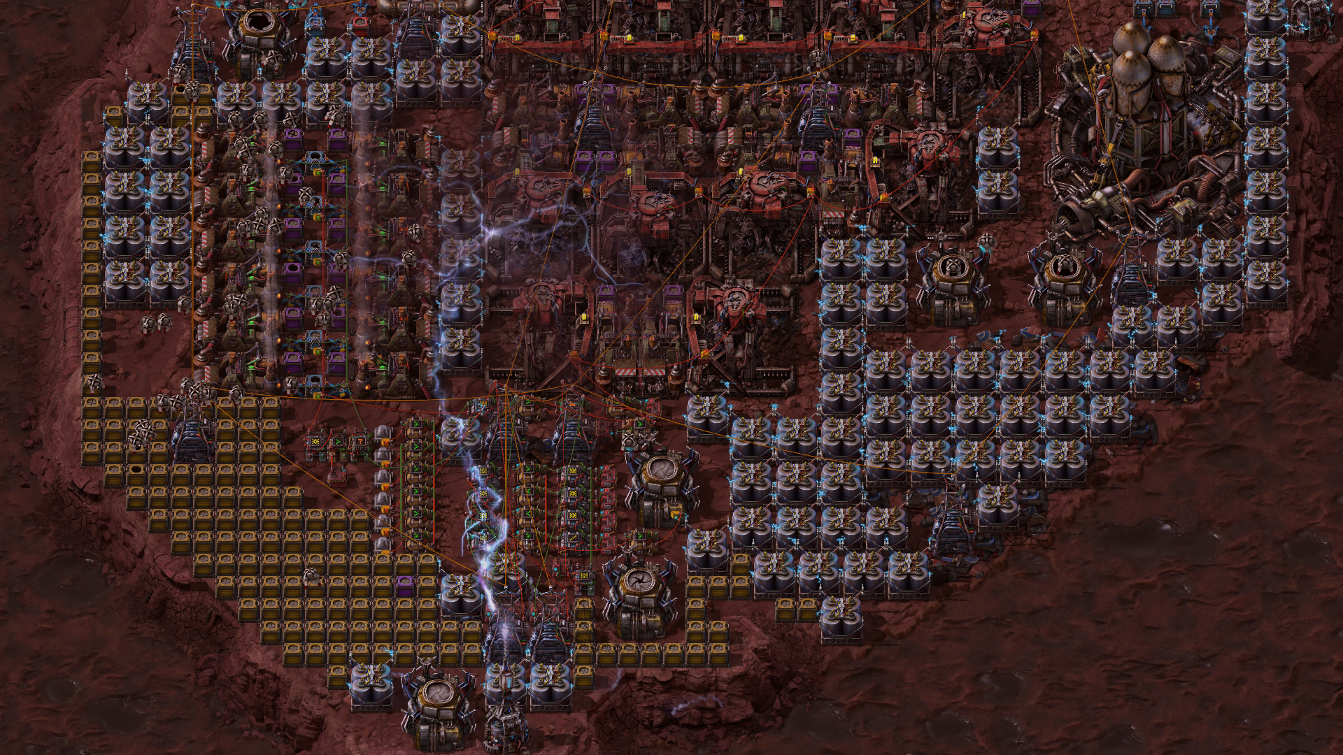 Factorio Space Age: плотная сеть производственных машин, конвейеров и накопителей на Фульгоре
